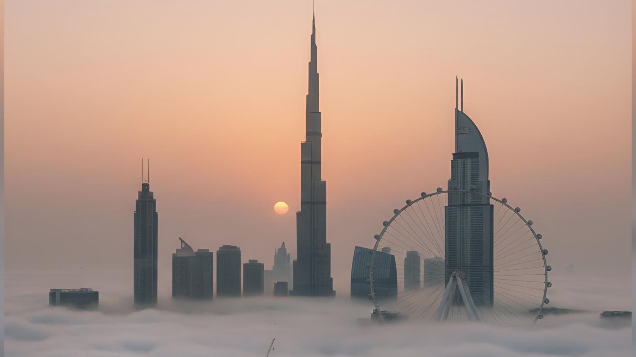 Dubai skyline above the clouds at golden hour