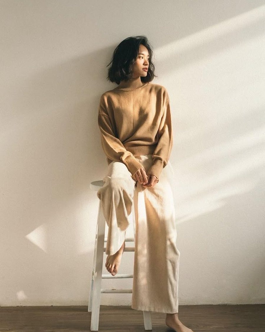 AI-styled look — brown knit and cream trousers
